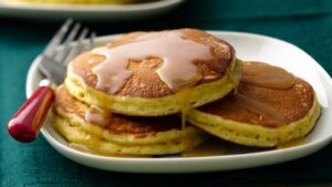 Eggnog Pancakes with Maple Butter Rum Drizzle
